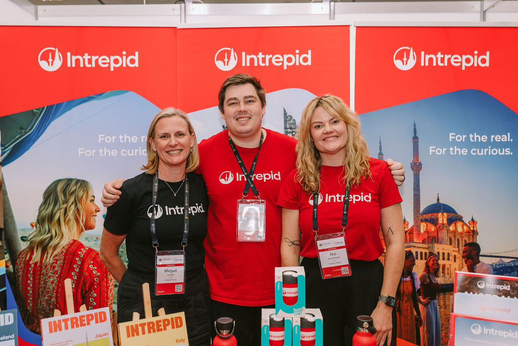 three Intrepid employees at a trade show