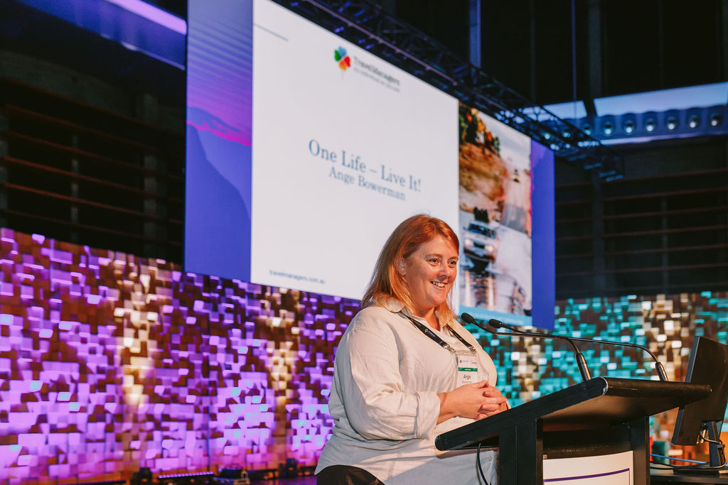 woman presenting on stage