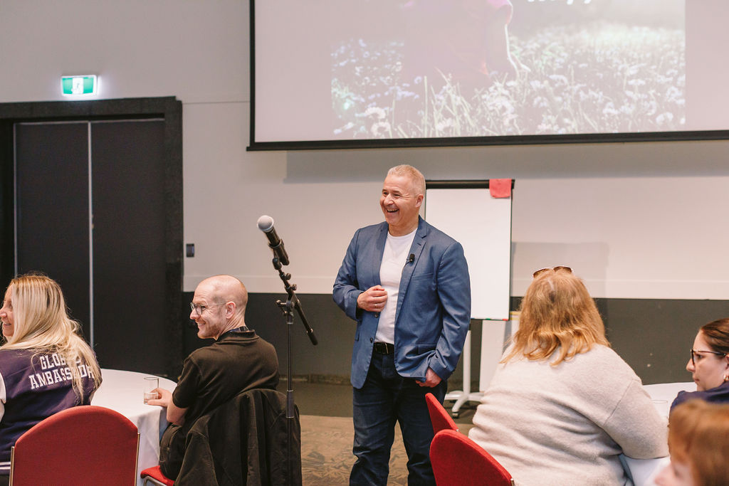 man presenting at conference