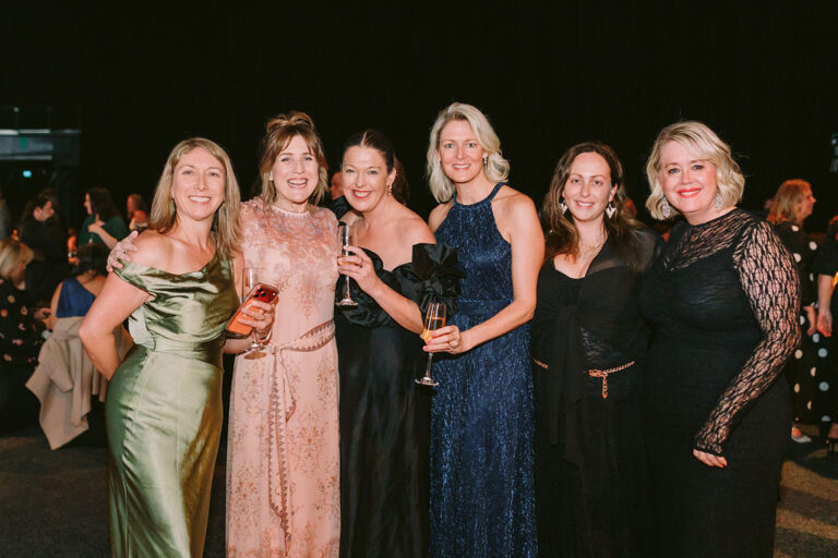 six personal travel managers at a black tie event